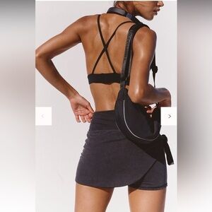 Free People black adjustable Bulls Eye Sling Bag New